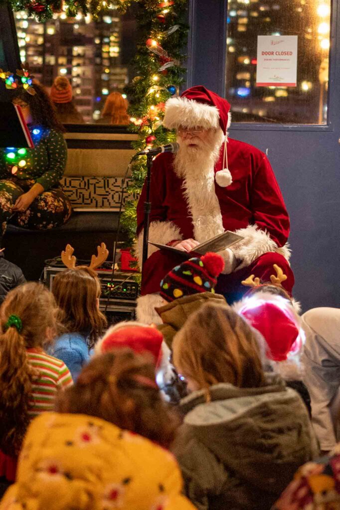 Santa Clause reading 'Twas the Night Before Christmas on board the Argosy Christmas Ship Festival in Seattle