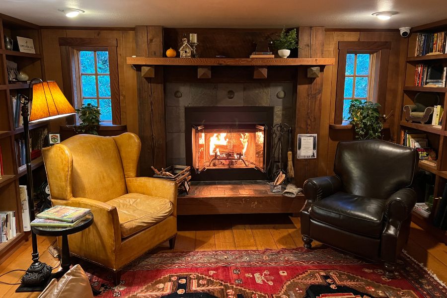 Fireplace and cozy reading nook inside the Lodge at Treehouse point seattle